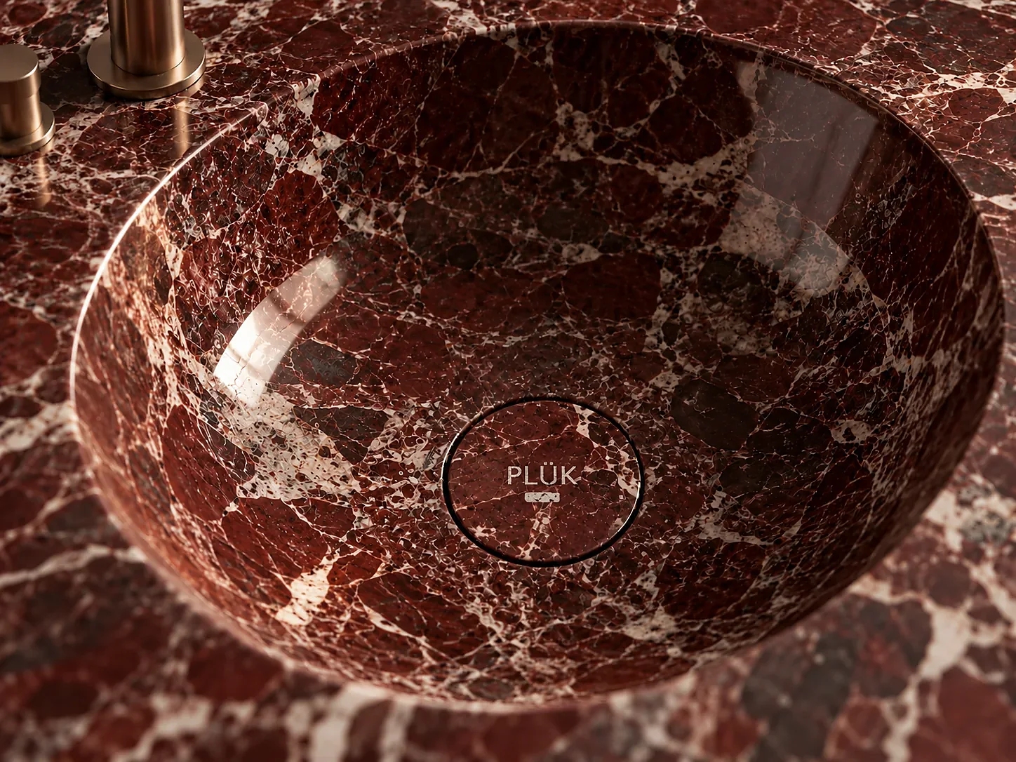 Burgundy marble basin with PLÜK drain detail