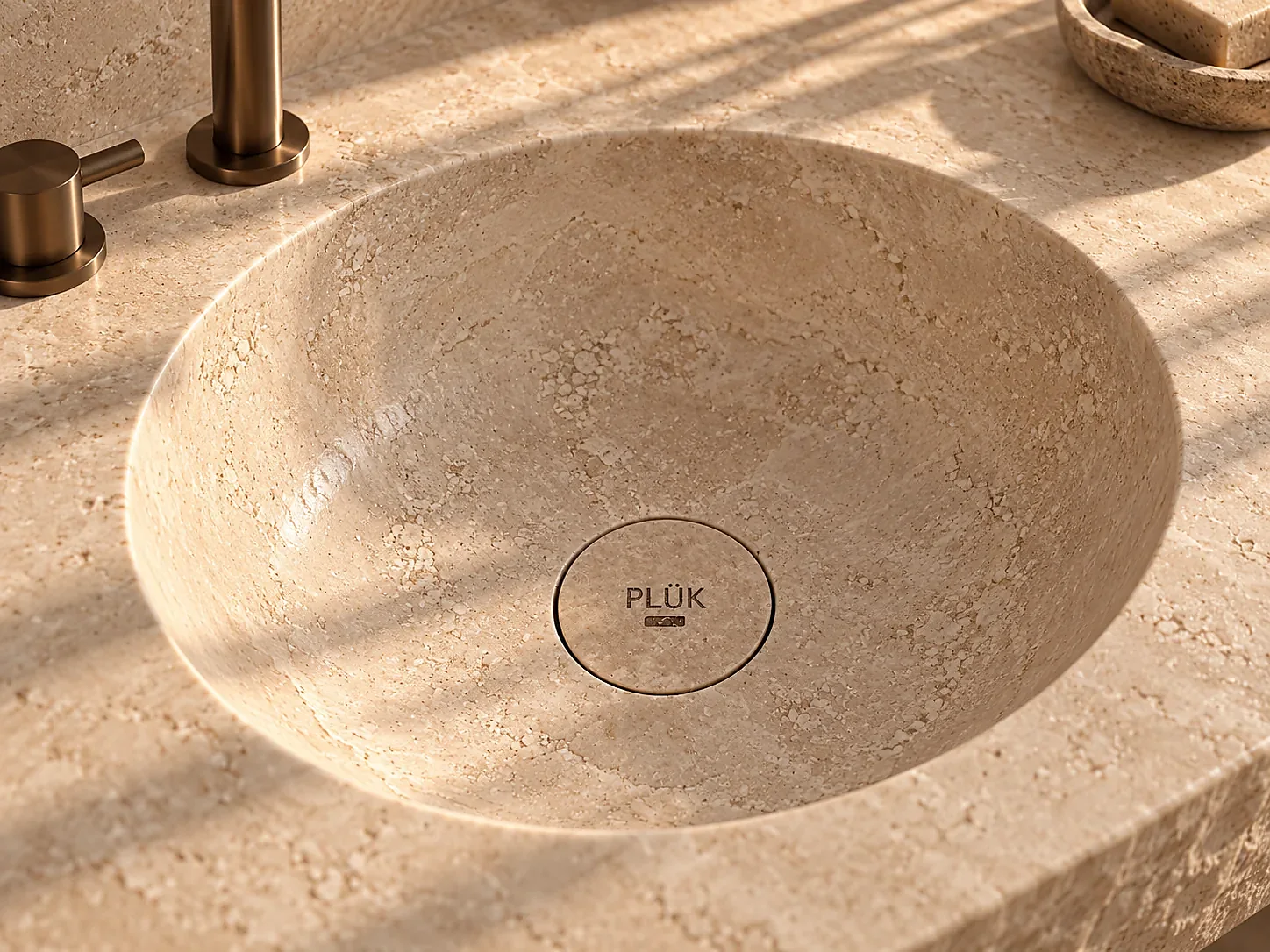Ivory travertine basin close-up in natural light